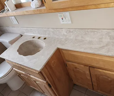 Bathroom vanity with sink and toilet